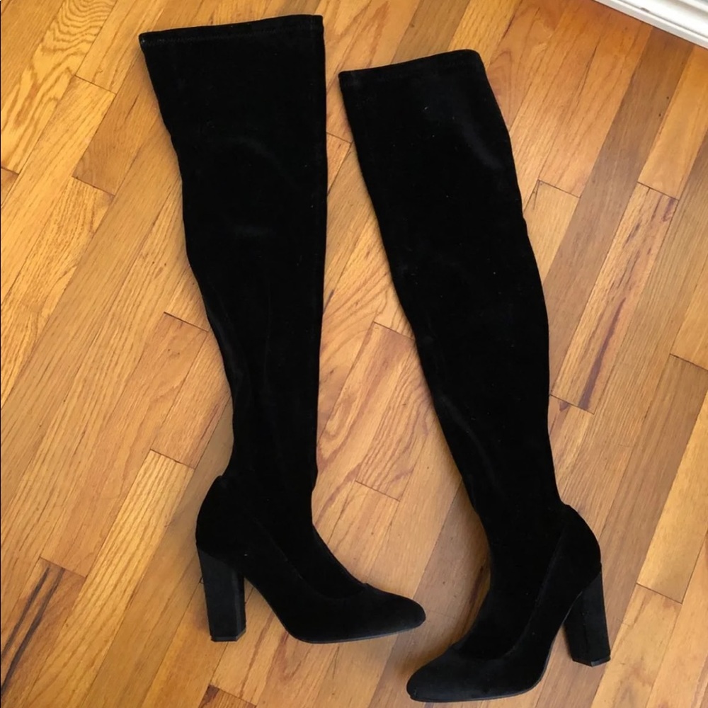 Thigh high black heeled boots